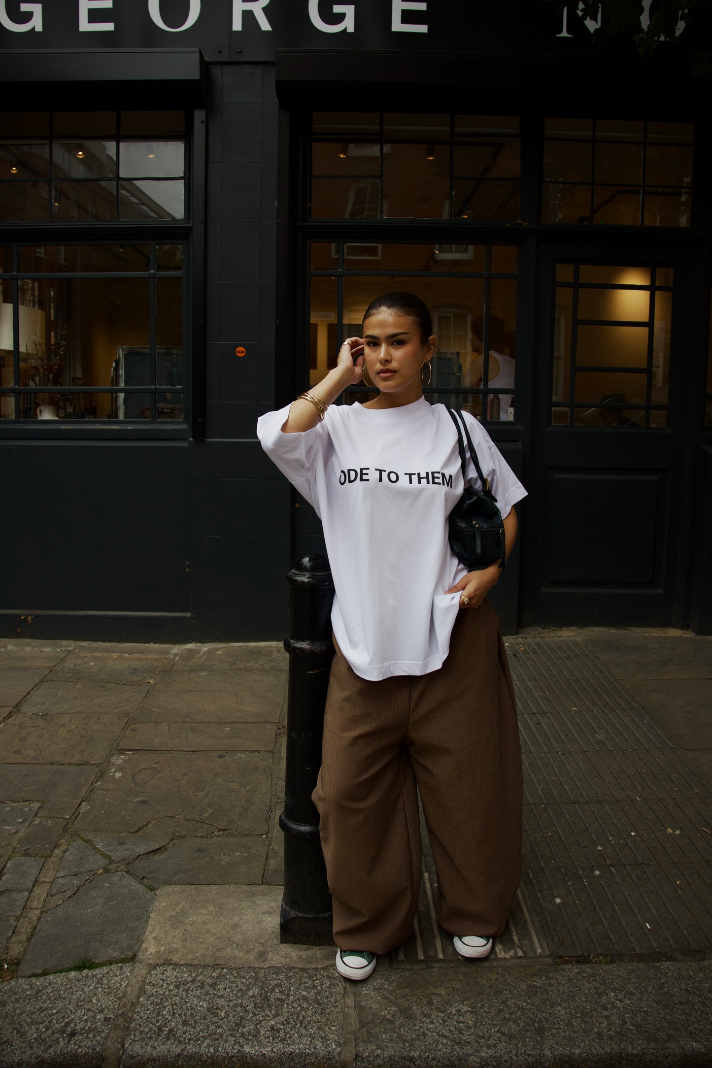 Women's baggy fit oversized white T-shirt and casual trousers