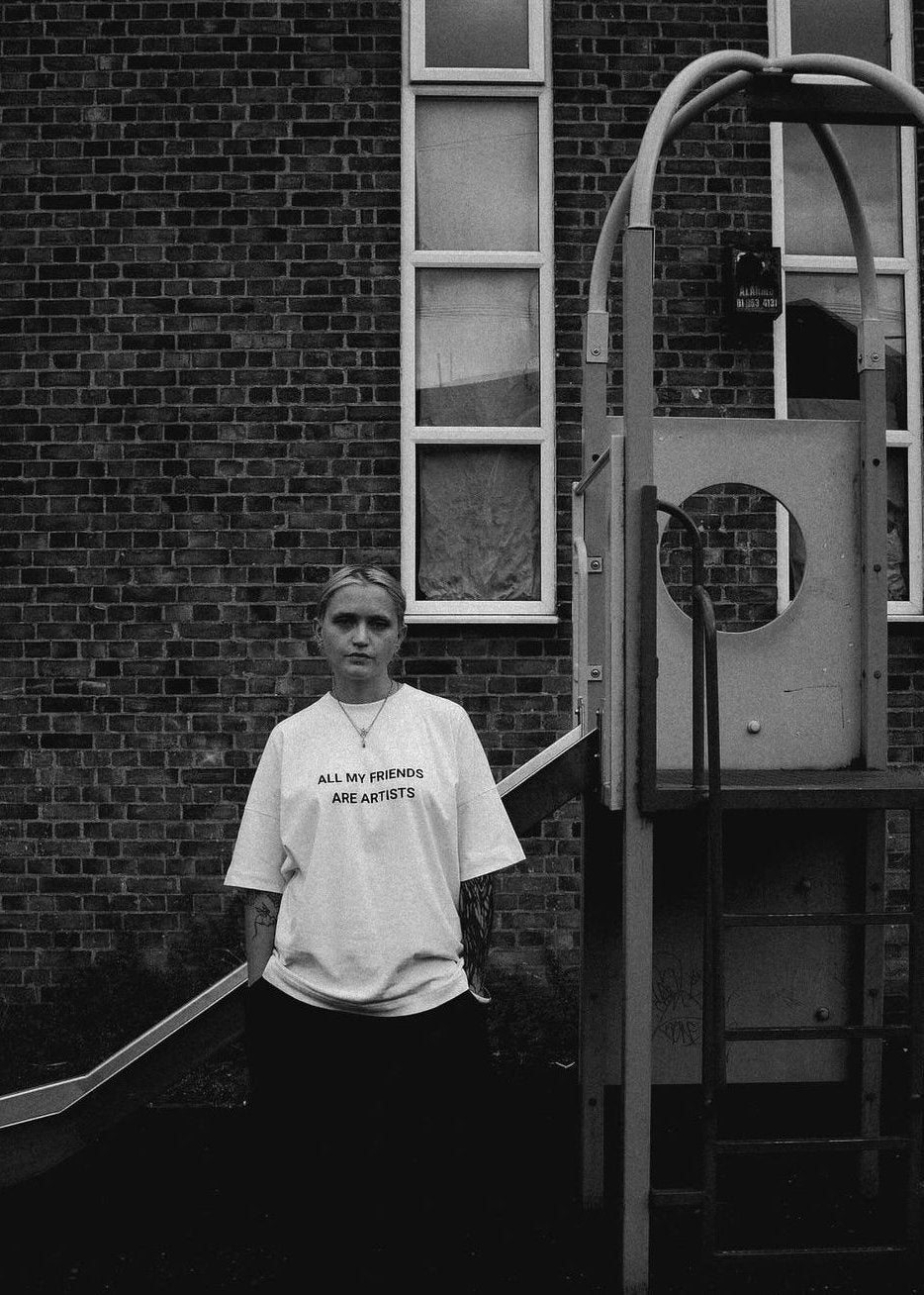 Artist, white t-shirt, black and white photo, neurodiversity